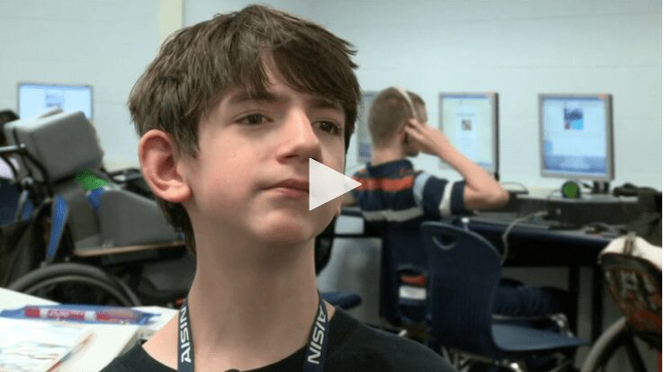 Video screenshot of a student being interviewed in a classroom about First Author
