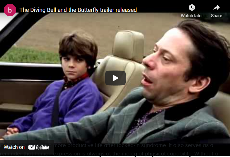 Video screenshot of a man and a child riding in a car.