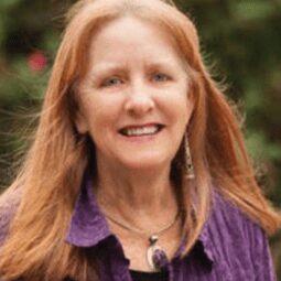 Headshot of Caroline Musselwhite wearing a purple shirt