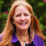 Headshot of Caroline Musselwhite wearing a purple shirt