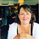 Maureen Donnelly smiles at the camera wearing a white shirt