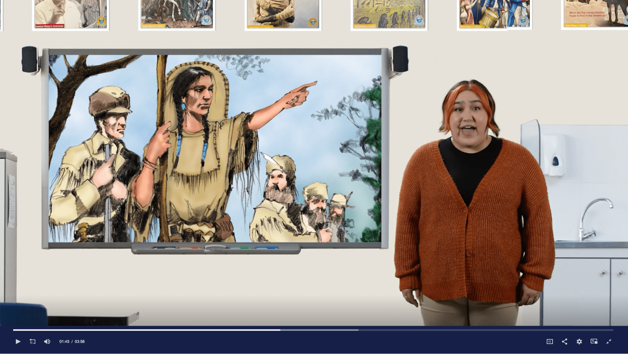Readtopia Sacagawea thematic unit Still video clip of a student next to a smart board with an image of Sacagawea on it.