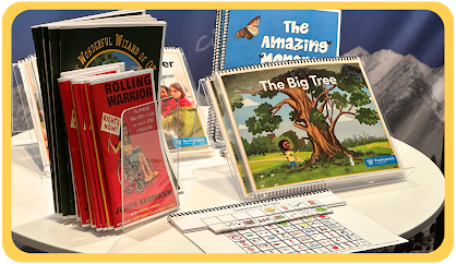 A table with Building Wings instructional materials and product resources including graphic novels and teacher guides.