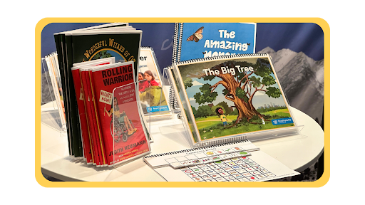 A table with Building Wings instructional materials and product resources including graphic novels and teacher guides.